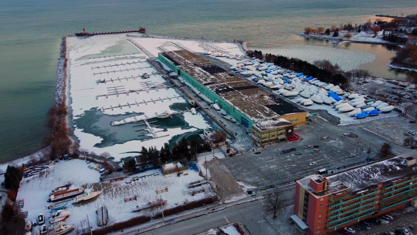 Port Credit Mississauga with boats parked for the winter near water - aerial