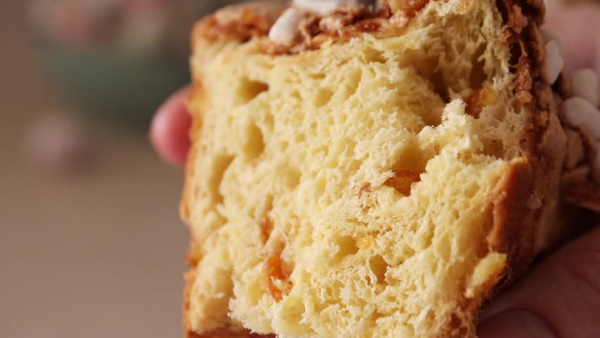 Colomba pasquale-Italian Easter cake. The crumb of the pie. Easter cake in the shape of a dove with almonds and orange peel. Traditional Italian pastries Royalty-Free Stock Footage #3463147561