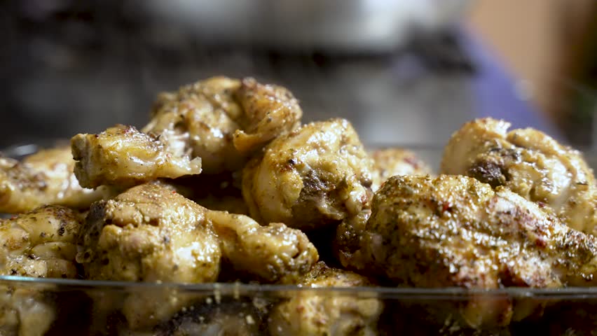 steam rising off freshly cooked chicken meat, showcased in a close-up bowl shot, evokes the anticipation of delicious food preparation. slow motion shot