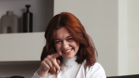 Young happy caucasin hipster vlogger woman waving hand looking at webcam talking to camera sit at table video conference calling in virtual chat meeting with social distance friend. - Powered by Shutterstock - Get 15% off with code: PIKWIZARD15