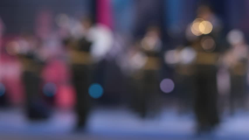 Texture blur and defocus, background for design. Stage light at a concert show. Artists perform on scene in light and smoke.