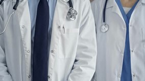 Professional healthcare team in uniform. Two doctors with stethoscopes are standing straight. Medicine concept