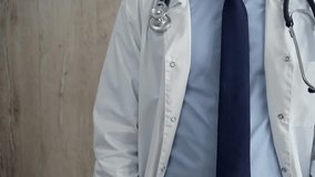 Professional doctor in white lab coat with stethoscope