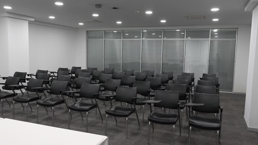 "Spacious Seminar Room with Chairs and Presentation Setup - Ideal for Corporate Workshops and Training Events" (Dual angle video) Royalty-Free Stock Footage #3463338701