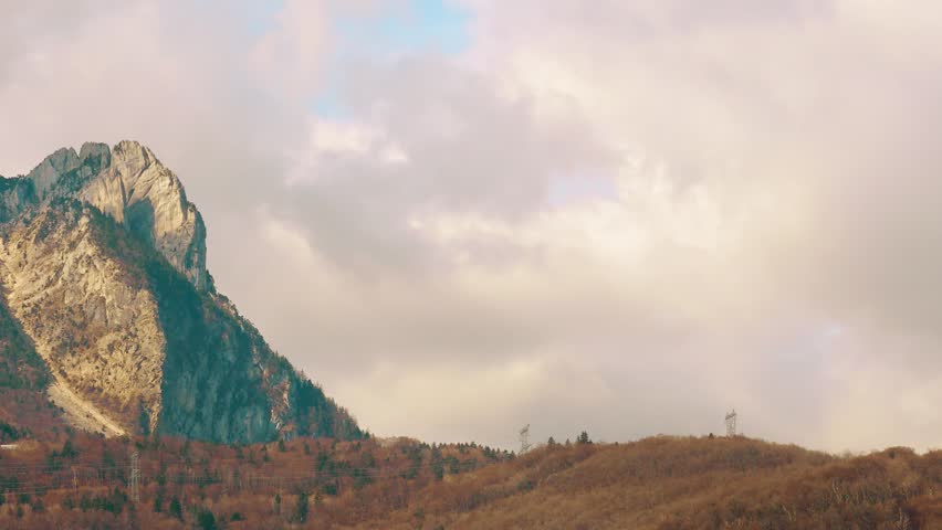 Electric power line pylons on the Vercors Alpine mountain range close to Grenoble in France, time lapse