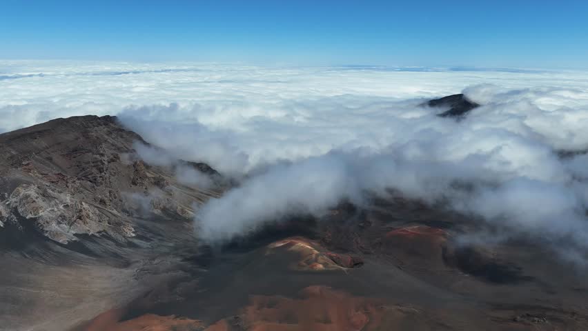 Haleakala Crater looms 10,023 feet above the Pacific Ocean, taking up three-quarters of Maui’s 727 square miles. Haleakala sunrise inspire 1.5 million visitors annually. Royalty-Free Stock Footage #3463404511