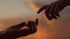 Hands touching each other. Finger Touching hands, silhouette of Hands in sky, couple feels love. Gentle touch with fingers of hands in sunset. Reunion of loved ones, family happiness. People together - Powered by Shutterstock - Get 15% off with code: PIKWIZARD15