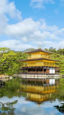 Kinkakuji temple on a pond, Kyoto, Japan. Time lapse video in autumn season on a sunny day.