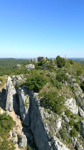 Aerial landscape of stunning giant rocks in the green highlands.
