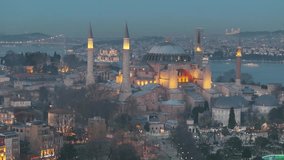 Happy Ramadan Feast Text in the Ayasofya (Hagia Sophia) Mosque, Illuminated Letters Between Minarets (Mahya) Drone Video, Sultanahmet Square Fatih, Istanbul Turkiye (Turkey)