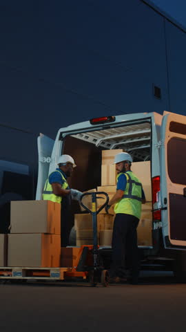 Vertical Screen. Logistics Warehouse Two Happy Friendly Laughing Workers use Hand Pallet Truck Start Loading Delivery Truck with Cardboard Boxes, Online Orders, Purchases, E-Commerce Goods