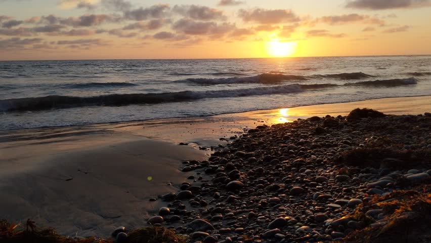 Southern California beach scenes, sunsets, surfers, tide pools and palms trees at Swamis Reef Surf Park and Moonlight Beach in Encinitas California. 