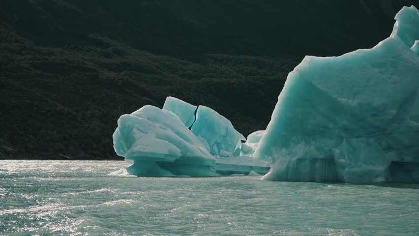 Blue Iceberg Floats In The Sea, Lago Argentino, Patagonia - POV Royalty-Free Stock Footage #3463732957