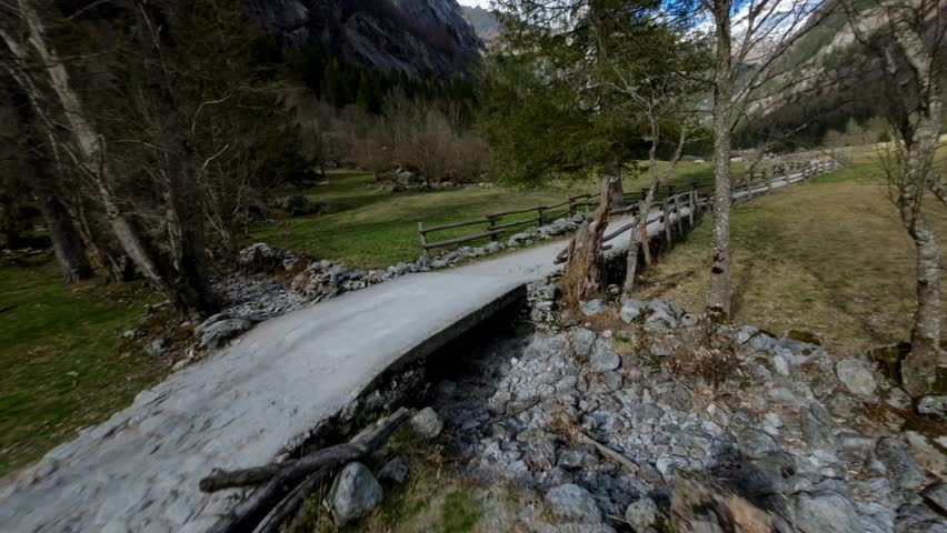 Crazy FPV drones racing along country path in Val di Mello in Northern Italy