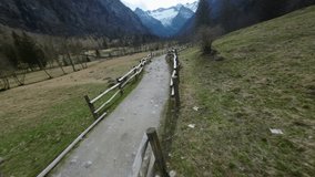 FPV drones racing along country path in Val di Mello in Northern Italy