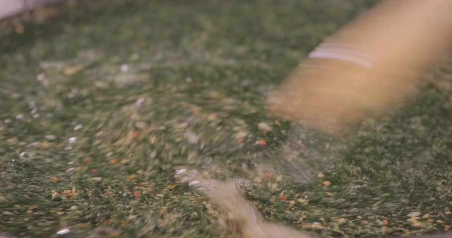 Egyptian Molokhya dropped on fried Garlic (TASHA) freshly made and shot on 4K. Molokhya is a Famous Egyptian Food in the Egyptian Cuisine and well known to be the most delicious one