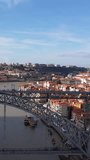 Porto, Portugal: Aerial view of famous historic European city, center with Luis I Bridge (Ponte Luis I) over Douro river, vertical footage
