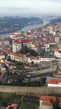 Porto, Portugal: Aerial view of the center of a famous historical European city and Douro river, vertical footage