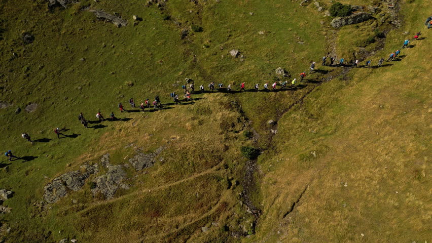 Aerial View of a Group of People Hiking. Concept of healthy lifestyle, weekend or vacation activity, recreational pursuit, trekking, backpacking, hobby, exploration, excursion. Vranica Mount, Bosnia