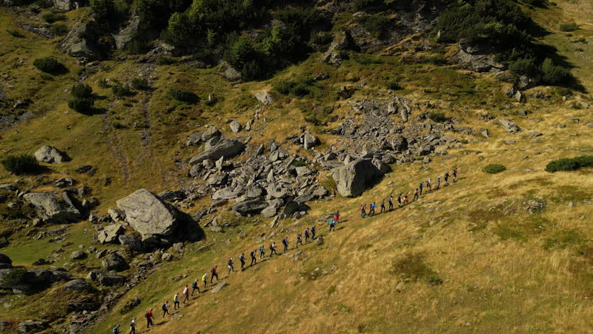 Drone Shot of a Group of People Hiking. Concept of healthy lifestyle, weekend activity, recreational pursuit, trekking, backpacking, hobby, exploration, excursion. Vranica Mount, Bosnia