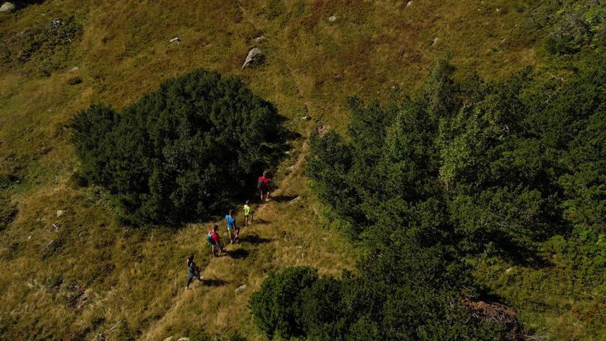 Aerial Shot of a Family Hiking Trail Path. Concept of healthy lifestyle, weekend activity, recreational pursuit, hobby