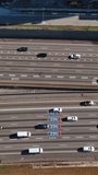 Aerial view of vehicles driving along Interstates 85 downtown Atlanta USA. Vertical video.