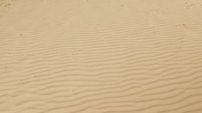 Close-up texture of sand, revealing it grain and pattern in exquisite detail