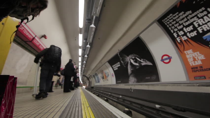 LONDON - OCTOBER 6, 2011: People waiting for the underground tube as it