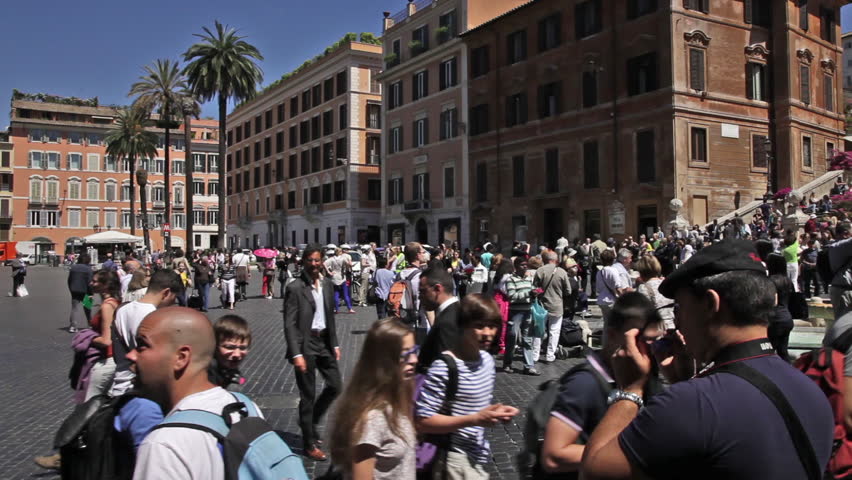 ROME - CIRCA MAY 2012: Multitudes stand in the Piazza di Spagna at the base of