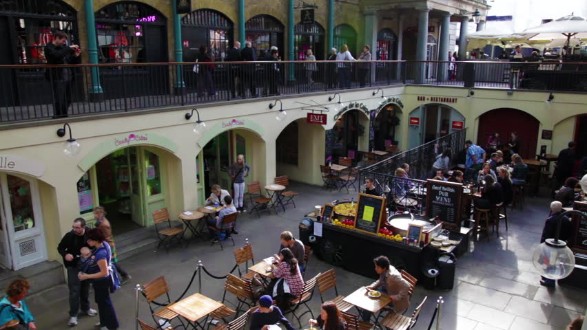 LONDON - OCTOBER 6, 2011: People sitting at tables at Covent Garden in London,