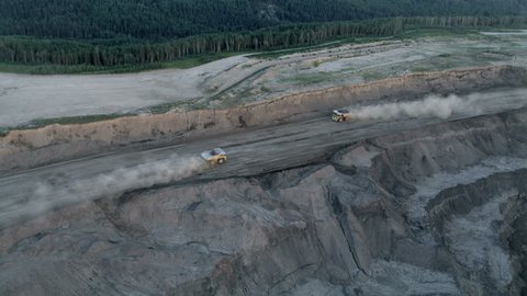 Aerial view of mining in the Athabasca tar sands region which consist of a surface tailings pond of chemical residue Fort McMurray Alberta Canada RED WEAPON