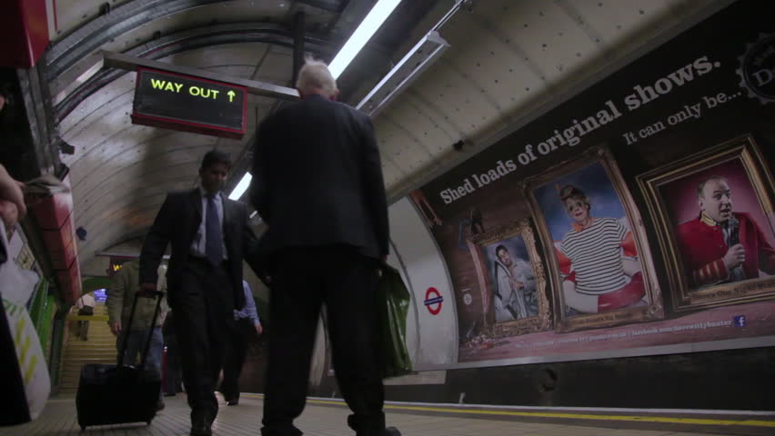 LONDON - OCTOBER 6, 2011:  Unidentified people walking next to the underground