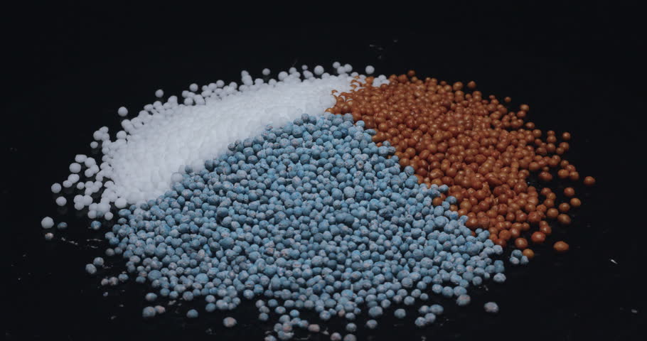 Closeup shot of chemical fertilizer being rotated
