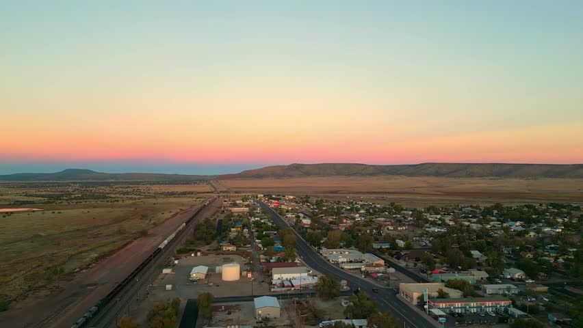 USA Route 66 And Railroad At Sunset In Seligman, Arizona, USA. aerial panning shot
