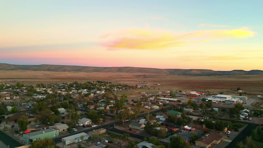 Seligman Town During Sunset With Colorful Sky In Arizona, USA. - aerial ascend shot