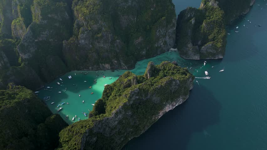 Pileh Lagoon is a beautiful lagoon with clear turquoise water on Phi Phi Ley Island. Thailand. High quality 4k footage Royalty-Free Stock Footage #3464209747