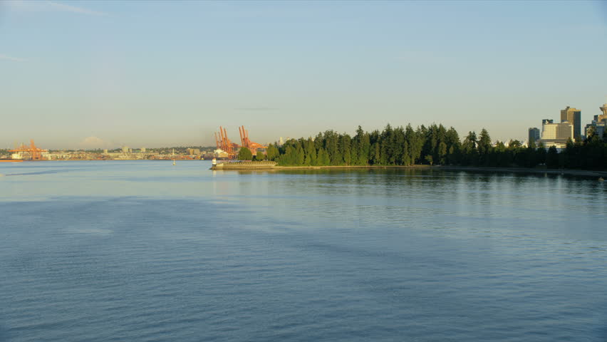 Aerial view across Brockton Point Lighthouse to container shipping cranes in Vancouver Harbour British Columbia Canada RED WEAPON