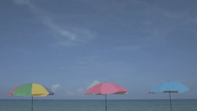 Thailand. Phuket. Umbrellas on the beach. Ungraded flat color footage