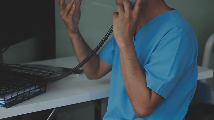 Surgical instruments in the operating room, the surgeon's assistant arranges them on a sterile takani. The concept of medecine, surgery, sterile area. Plastic surgery. Selective focus.
