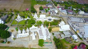 4K video resolution top view background frome drone flying over beautiful Thai Temple,home,road, at Northern Thailand.