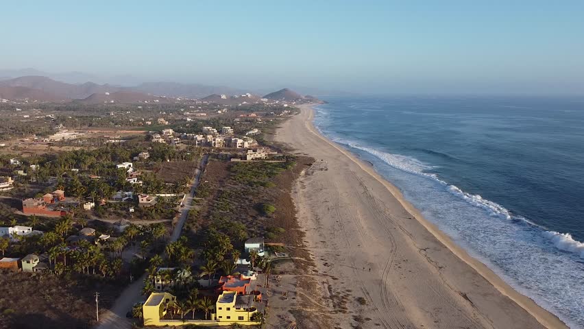 El Pescadero, Baja California Sur, Mexico with beach homes along sandy Pacific coastline