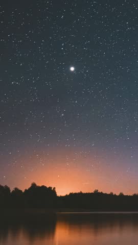 Lyepyel District, Vitebsk Province, Belarus. Real Colorful Night Stars Above Lepel Lake. Natural Starry Sky Background Backdrop Landscape. Time lapse. .