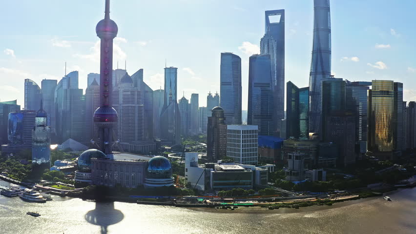 Aerial video of modern city buildings and skyscrapers scenery in Shanghai. Drone ascending to shoot.
