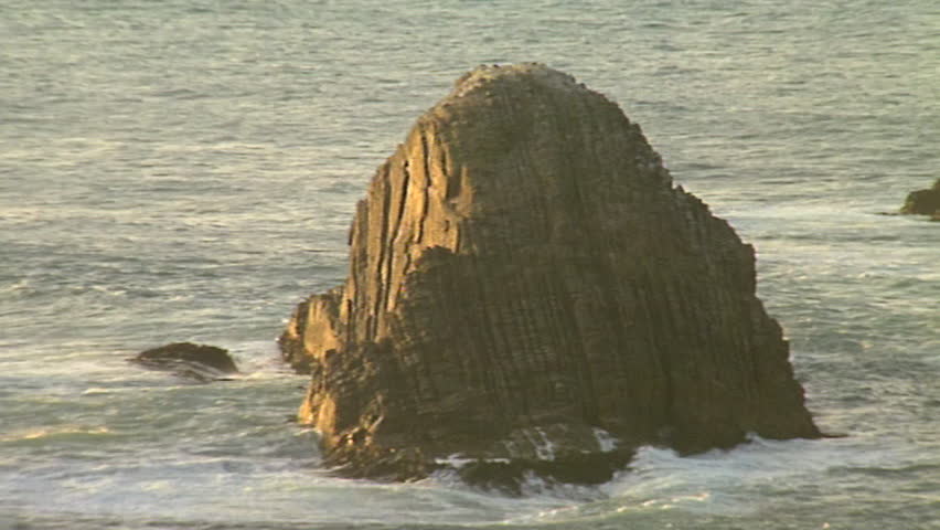 Waves crashing against rock