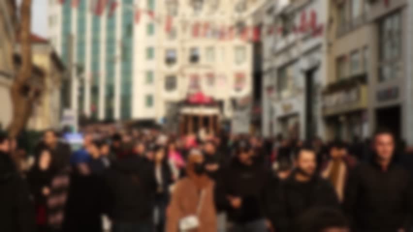 Blurred crowd of people are walking on Istiklal Street of Taksim in 2 time slow motion