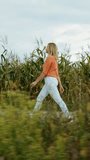 Young Pretty Caucasian Happy Girl Woman Run At Cornfield Summertime. Healthy Lifestyle Concept. Focus And Concentration Concept. Managing Stress. Daily Calm.