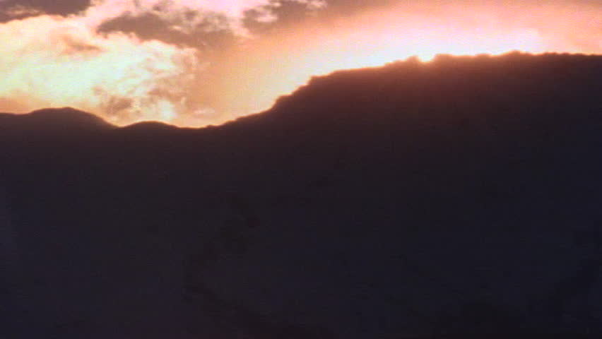 Silhouetted horizon as dawn breaks 
