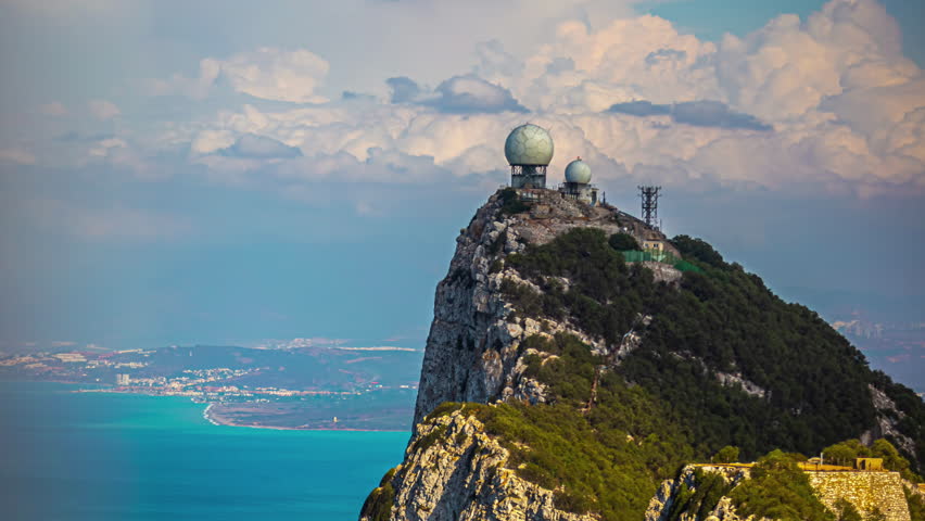 Timelapse of moving clouds above Radar station at the top of the rock of Gibraltar