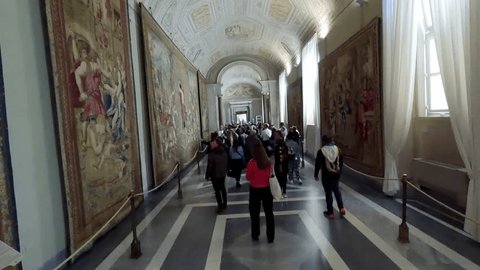 Vatican, Rome, Italy - Mar 15, 2024: Hyper time lapse of tourists people at gallery of Tapestries in Vatican. Tapestries were realized in Brussels by Pieter van Aelsta's School, during the pontificate Szerkesztői stockvideó