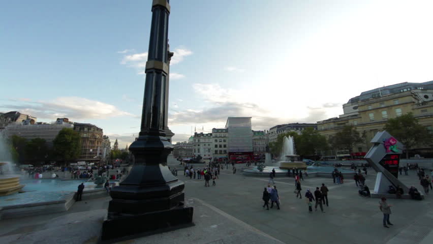 LONDON - OCTOBER 7, 2011: Olympic clock and a fountain on Trafalgar